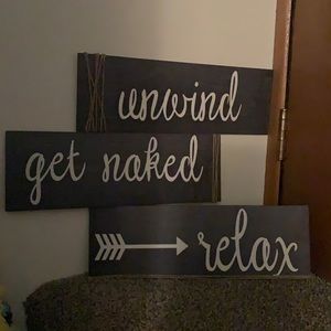 Relax, unwind, get naked wall signs.